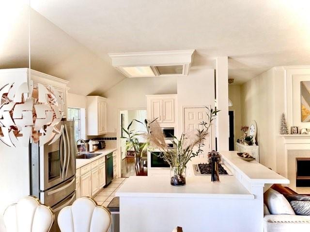 23006 Greenrush Dr, Katy, TX 77494 - kitchen with stainless steel appliances, a breakfast bar, light countertops, and a sink