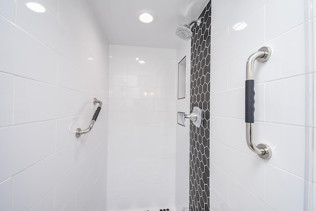 bathroom with tiled shower