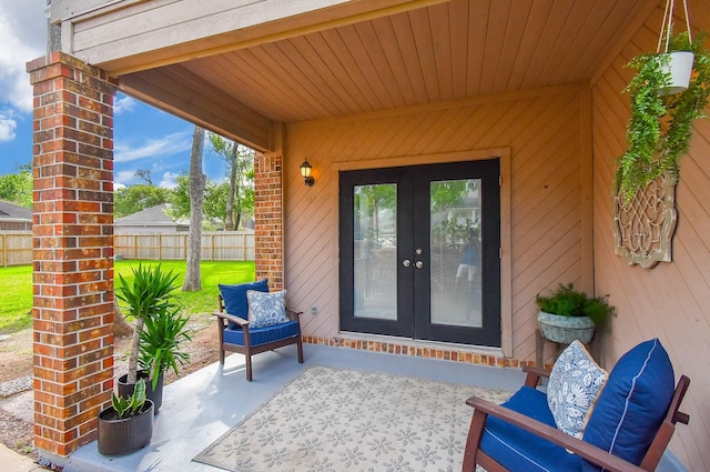 view of patio / terrace with french doors and fence
