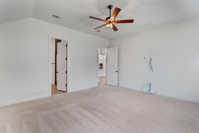 empty room with light carpet, visible vents, baseboards, and ceiling fan