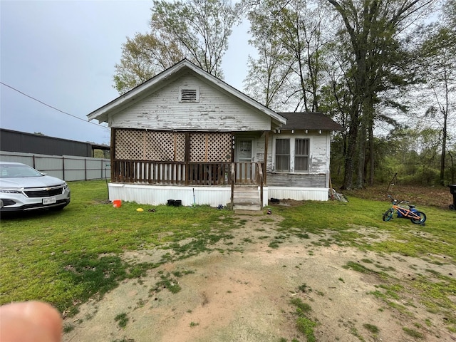 406 W Liberty Rd, Harleton, TX 75651 - view of front of house featuring a front lawn and fence
