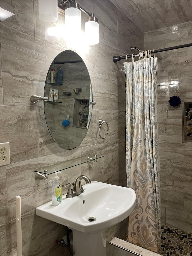 406 W Liberty Rd, Harleton, TX 75651 - bathroom with tile walls, a sink, and a stall shower