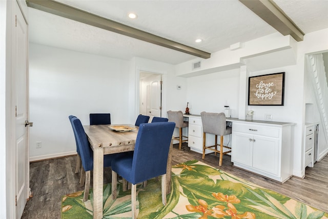 dining room with beamed ceiling, light wood-style flooring, visible vents, recessed lighting, and built in study area