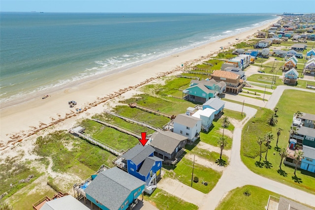 bird's eye view with a water view and a view of the beach
