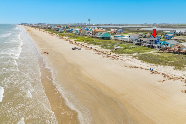 aerial view featuring a water view and a beach view