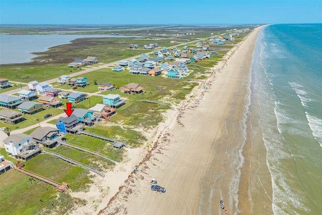 aerial view with a view of the beach and a water view