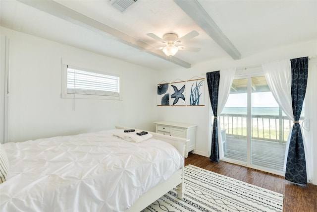bedroom with access to exterior, visible vents, dark wood-style floors, and beam ceiling