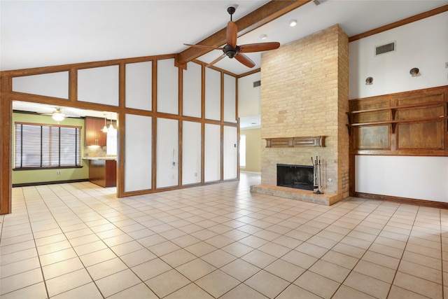 2327 Brookdale Dr, Kingwood, TX 77339 - unfurnished living room with a ceiling fan, high vaulted ceiling, light tile patterned floors, a fireplace, and beamed ceiling