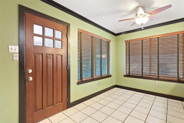 2327 Brookdale Dr, Kingwood, TX 77339 - foyer entrance with a ceiling fan, baseboards, and crown molding