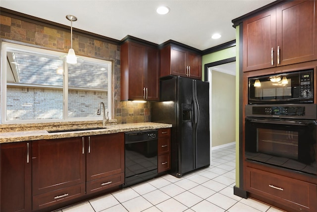 2327 Brookdale Dr, Kingwood, TX 77339 - kitchen with black appliances, a sink, light stone countertops, pendant lighting, and baseboards