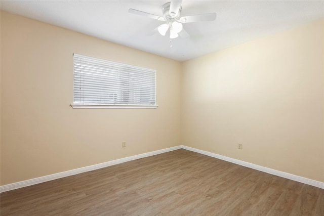 2327 Brookdale Dr, Kingwood, TX 77339 - spare room with light wood finished floors, baseboards, and ceiling fan