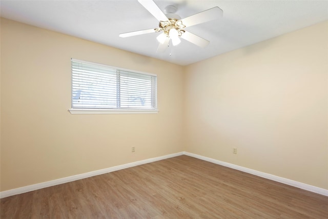 2327 Brookdale Dr, Kingwood, TX 77339 - empty room featuring light wood-style floors, baseboards, and a ceiling fan