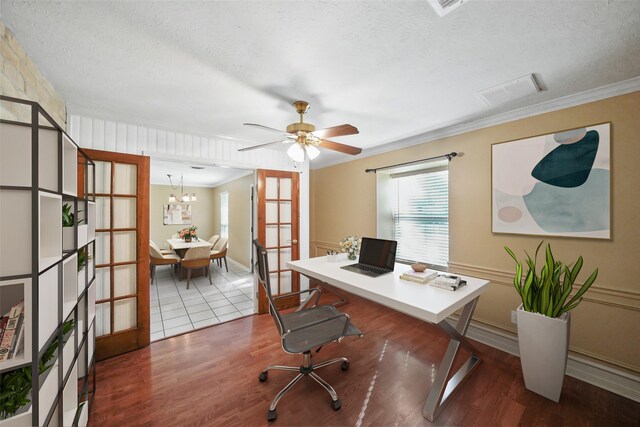 2327 Brookdale Dr, Kingwood, TX 77339 - office space with wood finished floors, french doors, a textured ceiling, ornamental molding, and baseboards