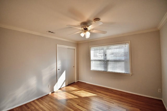 5718 Benning Dr, Houston, TX 77096 - spare room featuring a ceiling fan, crown molding, baseboards, and wood finished floors