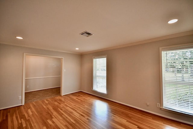 5718 Benning Dr, Houston, TX 77096 - spare room with ornamental molding, wood finished floors, baseboards, and recessed lighting