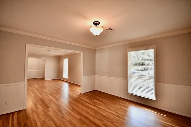 5718 Benning Dr, Houston, TX 77096 - unfurnished room featuring healthy amount of natural light, wood finished floors, crown molding, and baseboards