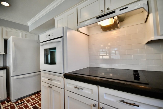 5718 Benning Dr, Houston, TX 77096 - kitchen with white appliances, ornamental molding, brick flooring, dark countertops, and decorative backsplash