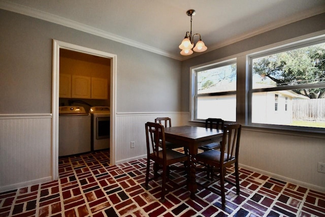 5718 Benning Dr, Houston, TX 77096 - dining room with brick floors, independent washer and dryer, wainscoting, ornamental molding, and baseboards