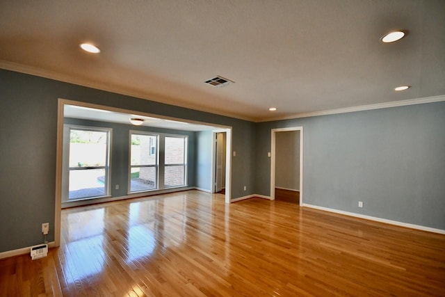 5718 Benning Dr, Houston, TX 77096 - unfurnished room featuring crown molding, baseboards, wood finished floors, and recessed lighting