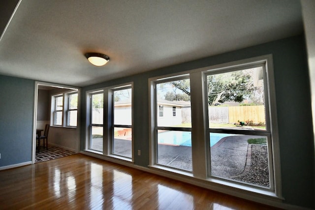 5718 Benning Dr, Houston, TX 77096 - doorway to outside with baseboards and wood finished floors