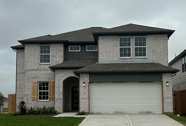 13724 Seneca Lake Dr, Texas City, TX 77568 - view of front facade featuring concrete driveway, roof with shingles, brick siding, and an attached garage