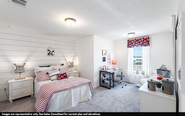 13724 Seneca Lake Dr, Texas City, TX 77568 - carpeted bedroom with a textured ceiling, wooden walls, baseboards, and visible vents
