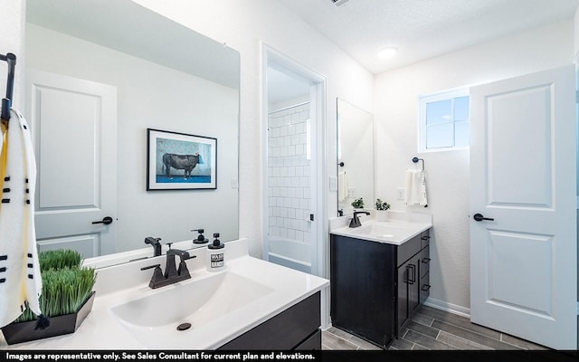 13724 Seneca Lake Dr, Texas City, TX 77568 - full bath featuring two vanities, a sink, and wood finish floors
