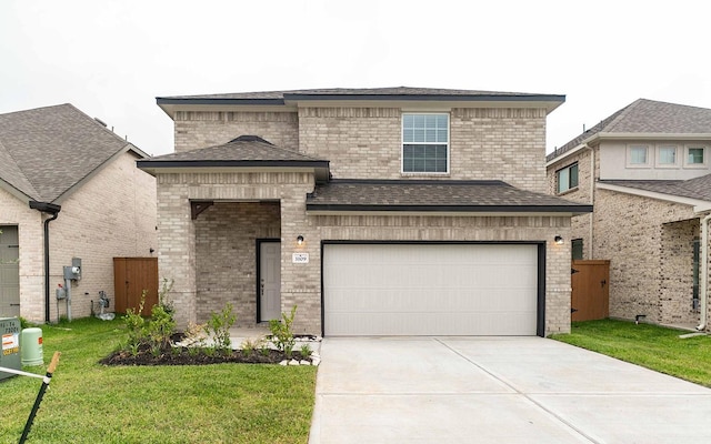 3109 Aqua Wave Dr, Texas City, TX 77568 - view of front of home with driveway, a garage, brick siding, and a front yard