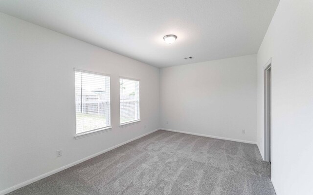 3109 Aqua Wave Dr, Texas City, TX 77568 - spare room featuring carpet and baseboards