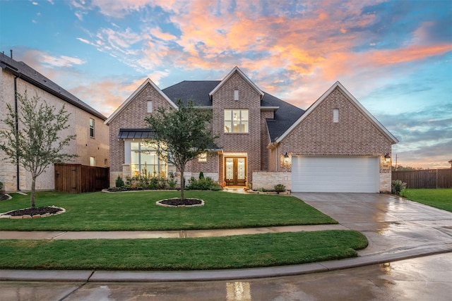 traditional-style house featuring brick siding, driveway, and fence