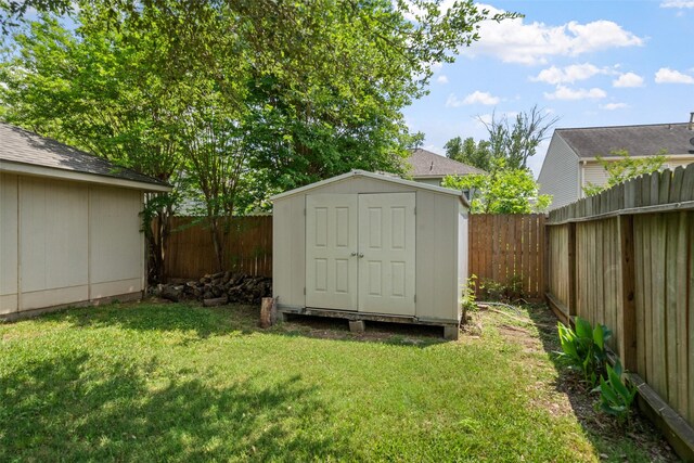 view of shed with a fenced backyard
