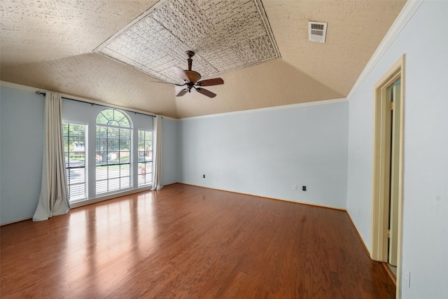 unfurnished room featuring wood finished floors, visible vents, crown molding, and ceiling fan