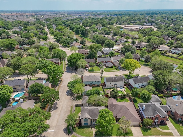 birds eye view of property with a residential view