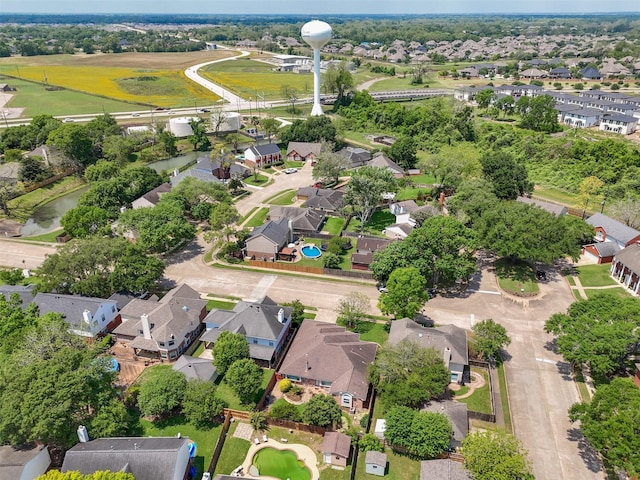 bird's eye view featuring a residential view and a water view