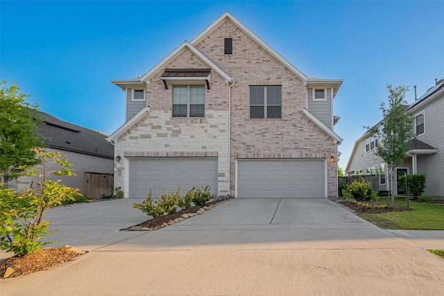 traditional home featuring brick siding, an attached garage, and driveway