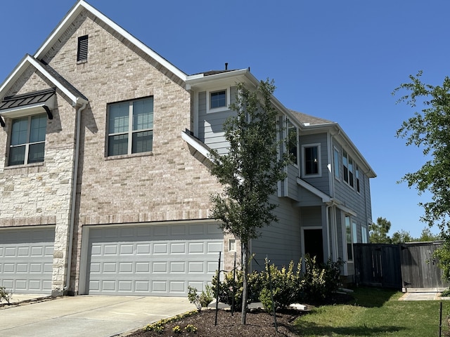 view of front of house featuring an attached garage and concrete driveway