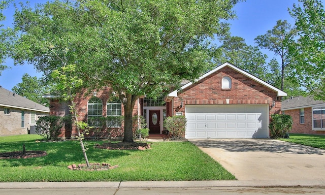 12506 Opal Valley Dr, Tomball, TX 77377 - view of front of home with concrete driveway, a front yard, brick siding, and an attached garage