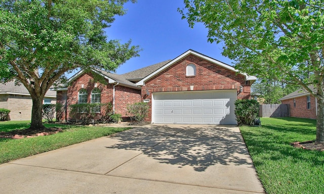 12506 Opal Valley Dr, Tomball, TX 77377 - single story home with driveway, an attached garage, a front yard, brick siding, and fence