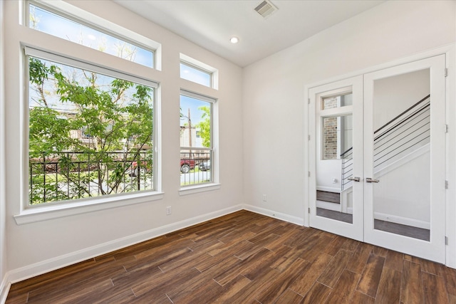 unfurnished room with stairs, visible vents, baseboards, dark wood-style floors, and recessed lighting