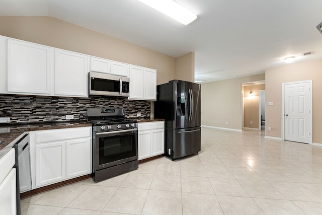 kitchen featuring light tile patterned flooring, white cabinets, visible vents, decorative backsplash, and appliances with stainless steel finishes