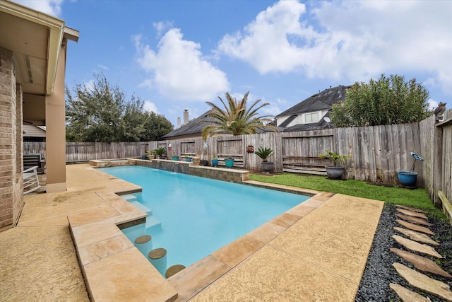 view of swimming pool with a fenced in pool, a fenced backyard, and a patio area