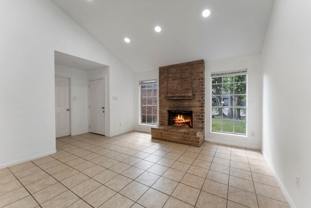 19822 Brightstone Dr, Humble, TX 77338 - unfurnished living room featuring light tile patterned floors, a brick fireplace, and baseboards