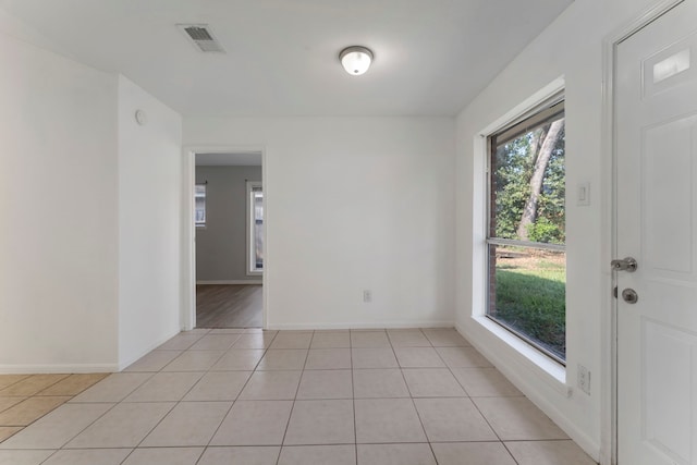 19822 Brightstone Dr, Humble, TX 77338 - unfurnished room featuring light tile patterned floors, baseboards, and visible vents