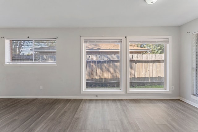19822 Brightstone Dr, Humble, TX 77338 - spare room featuring wood finished floors and baseboards