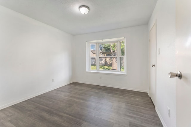 19822 Brightstone Dr, Humble, TX 77338 - spare room with dark wood-style flooring and baseboards