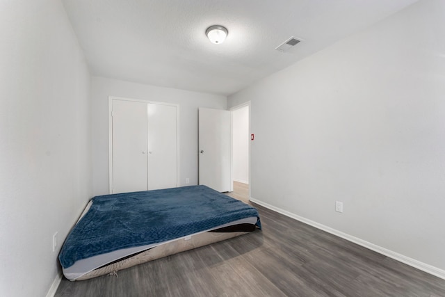 19822 Brightstone Dr, Humble, TX 77338 - bedroom featuring visible vents, baseboards, and wood finished floors