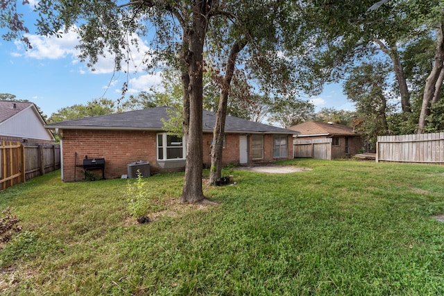 19822 Brightstone Dr, Humble, TX 77338 - view of yard featuring central AC and a fenced backyard