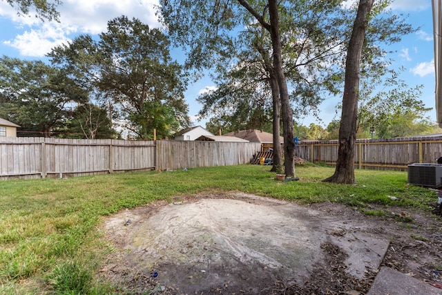 19822 Brightstone Dr, Humble, TX 77338 - view of yard featuring central air condition unit and a fenced backyard