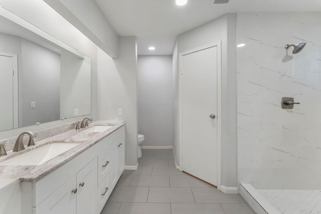 19822 Brightstone Dr, Humble, TX 77338 - bathroom with a sink, toilet, a marble finish shower, and double vanity