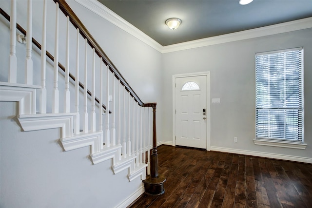 foyer with crown molding, baseboards, wood-type flooring, and stairs